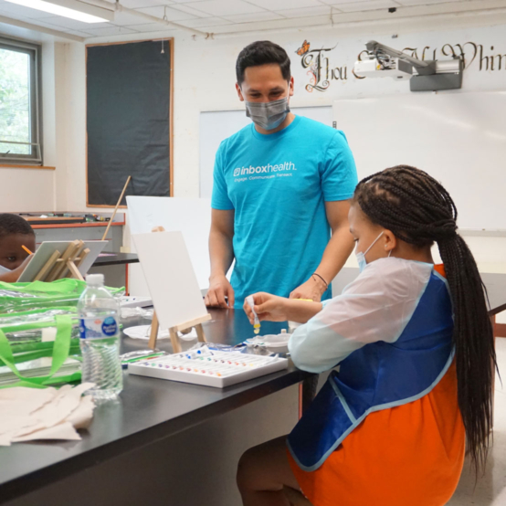 inbox team member volunteering at a local school