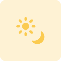 an icon showing a sun and crescent moon in yellow, against a very light yellow background